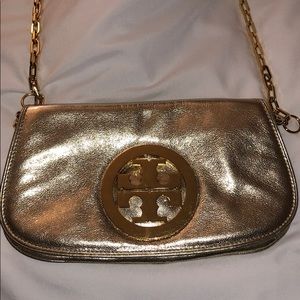 Gold shimmer Tory Burch purse.
